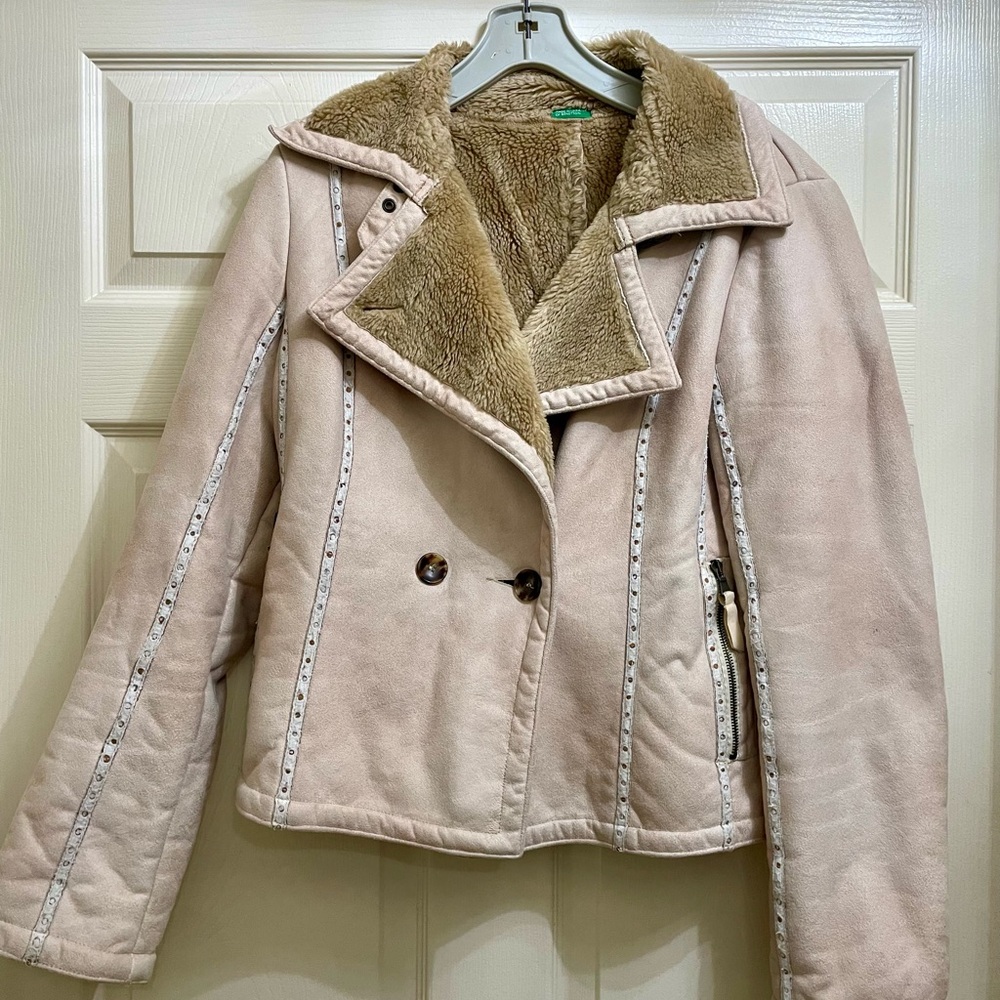 Suede with leather trim on the outside, button closures, furry lining inside.